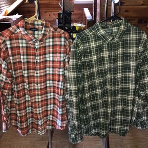 Two long sleeve flannel shirts.